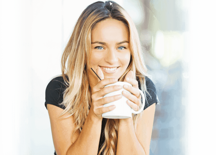 Smiling woman with coffee mug
